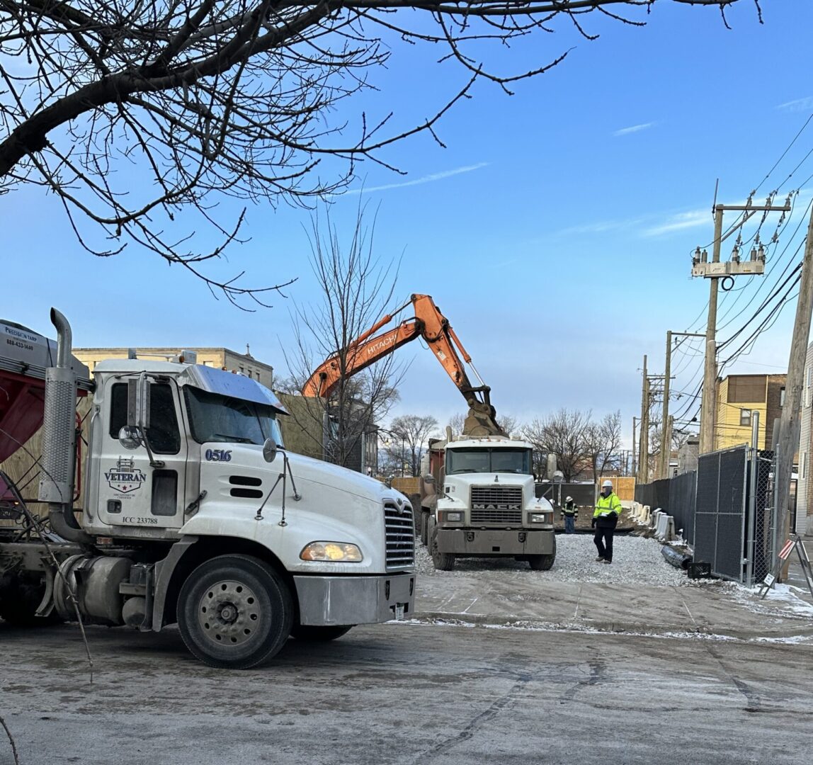 A dump truck is parked in the street.